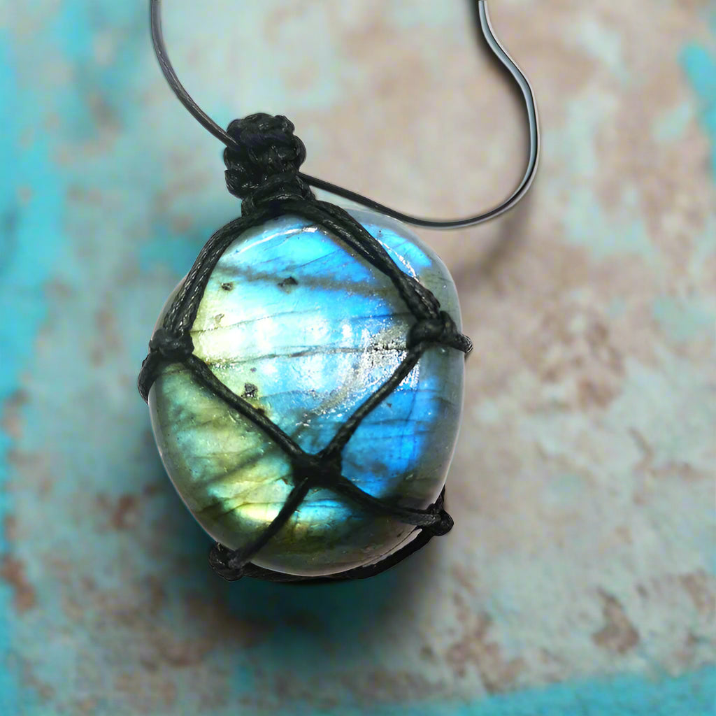Labradorite Protection Amulet Pendant - light blue stone background
