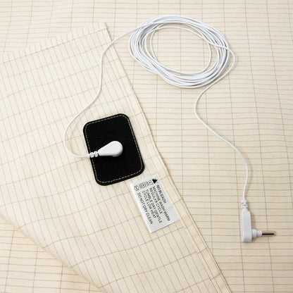 Close-up of Rejuviaa™ grounding sheet silver fiber grid