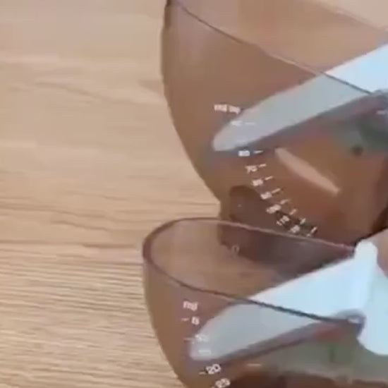 Widescreen video demonstration of QuickMeasure Magnetic Measuring Set in use, showcasing adjustable cups and spoons measuring dry and liquid ingredients accurately for cooking and baking